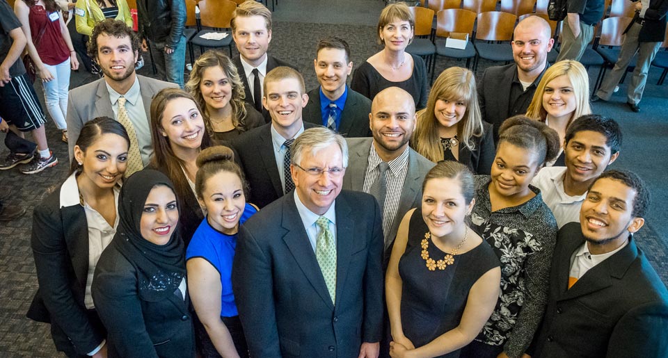 Photo of Dennis Bone and the first cohort of Feliciano Center students.