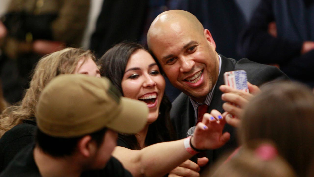 Photo of Cory Booker with students