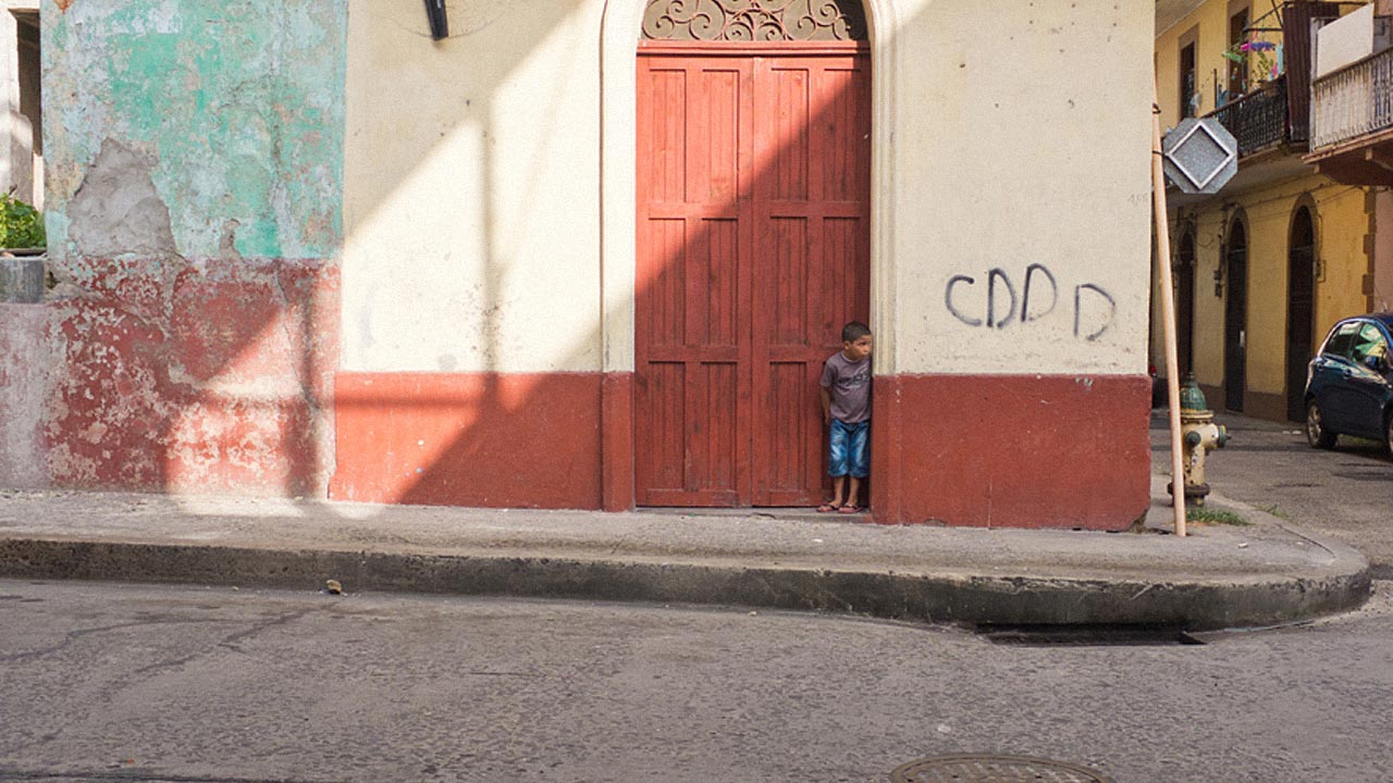 Photo of child standing in doorway