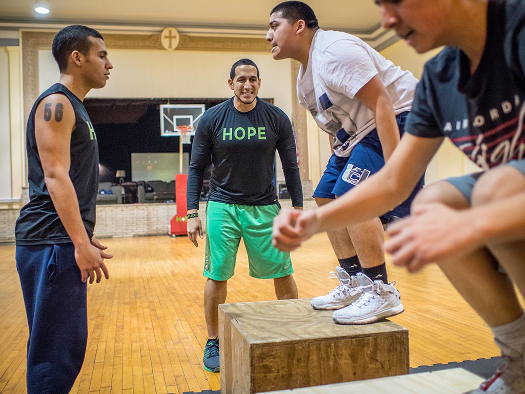 Gonzalez working with teens at the Hope + Future Center