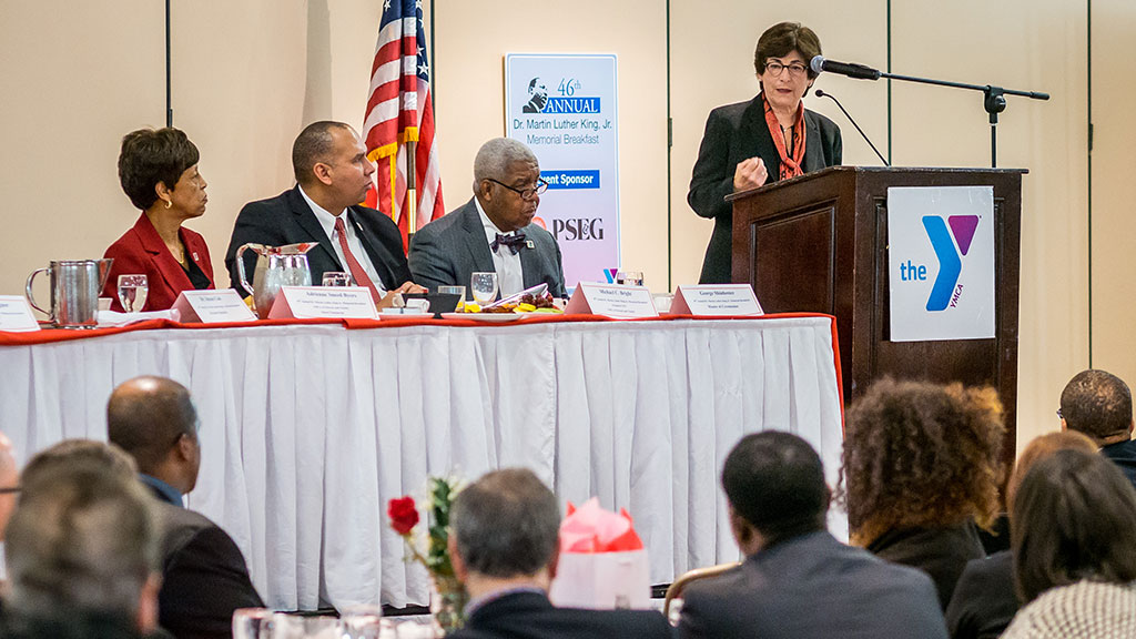 Photo of President Susan A. Cole addressing guests at MLK breakfast.