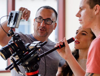 Photo of Doug Elkins with videographers.