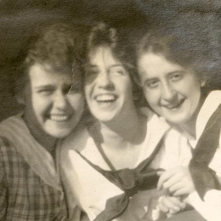 Three women smiling for photo in 1918.