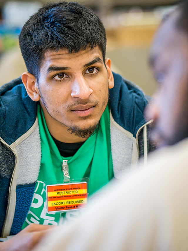 Tutor Paramvir Singh concentrates on the task at hand.
