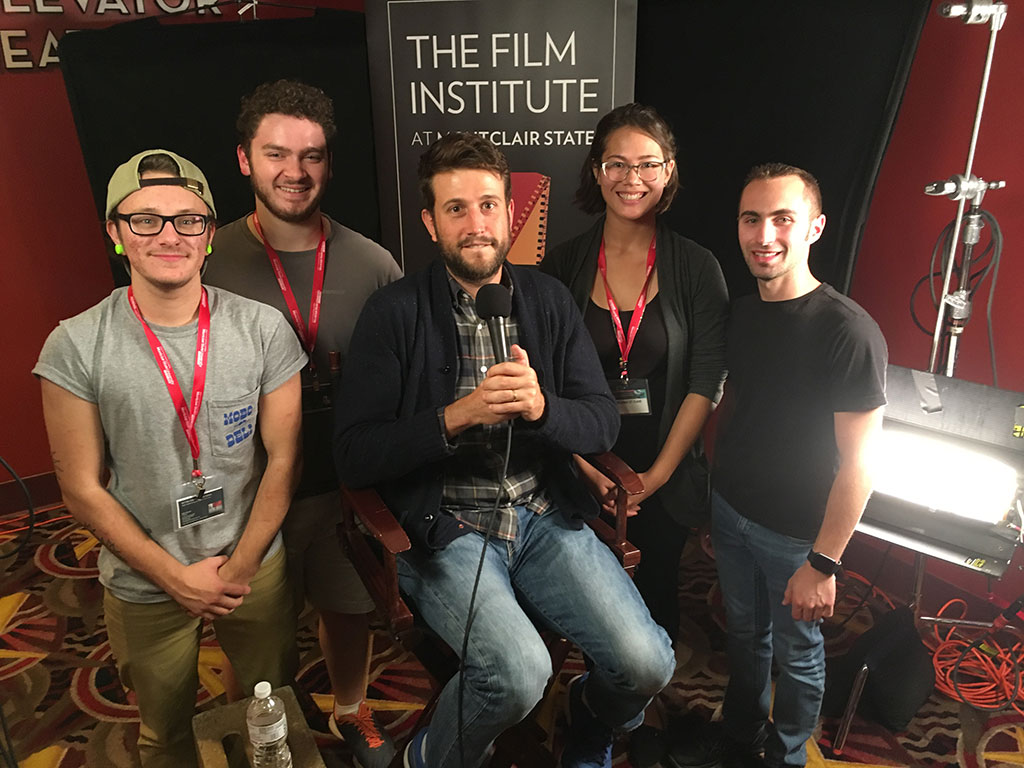 Shilowich poses with students (l to r, surrounding Shilowich) Asher Sosinsky, Nicholas Calisti, Melanie St. Clair and Nich Marchese.