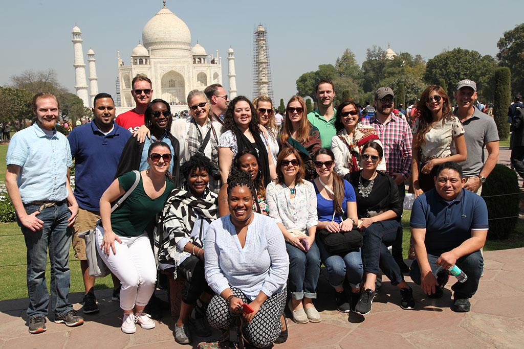 Feliciano School of Business MBA students posing in India in front of the Taj Mahal.