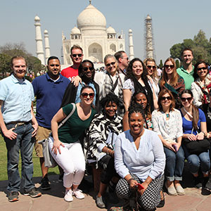 Feliciano School of Business MBA students posing in India in front of the Taj Mahal.