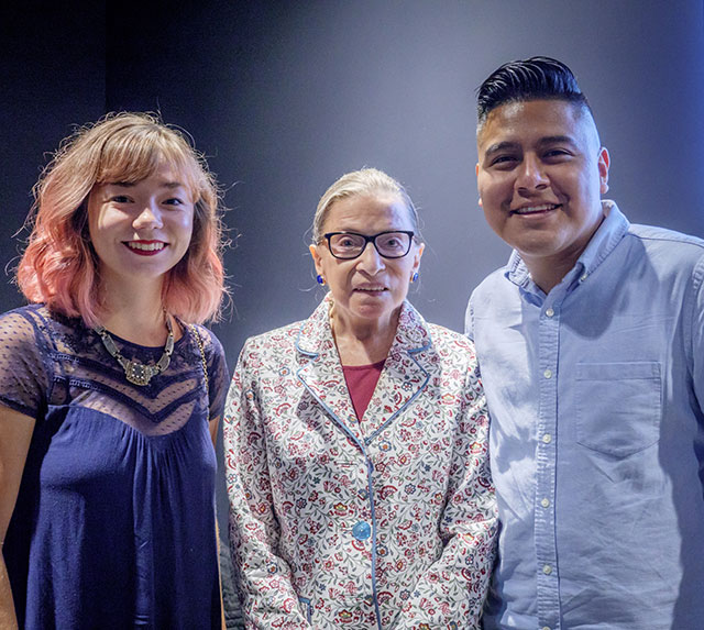 Ginsburg poses with recent graduates Allison Gormley and Gustavo Vasquez.