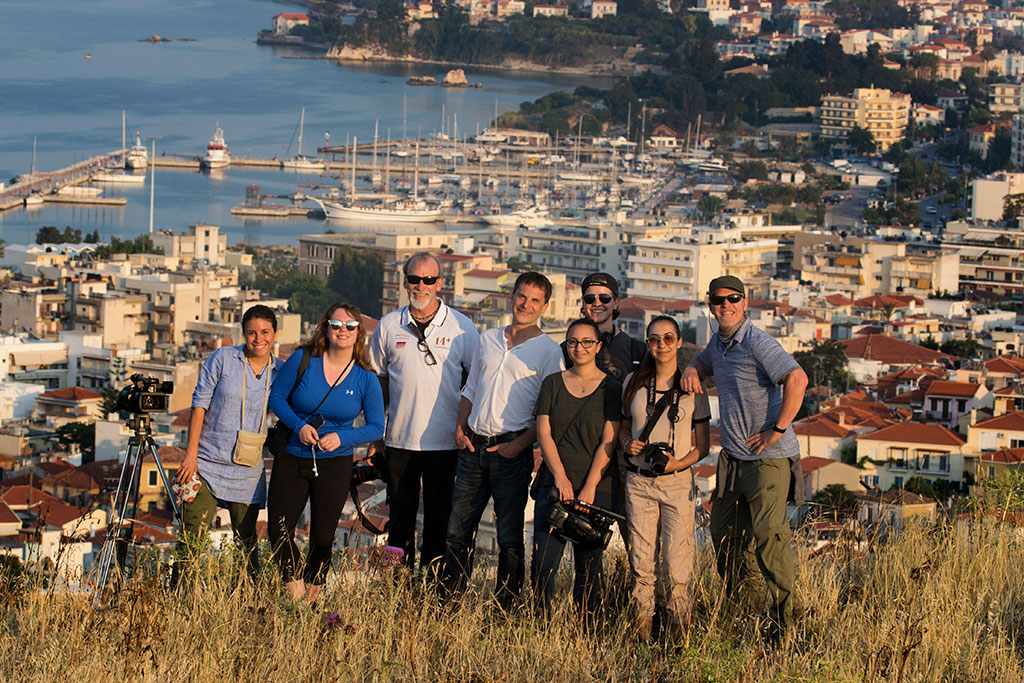 The School of Communication and Media team: Kristie Keleshian, Allison Councill, Steve McCarthy, David Sanders, Nadia Abbas, Shawn Latham, Danielle Weidner and Thomas Franklin, on a hill overlooking Mytilene.