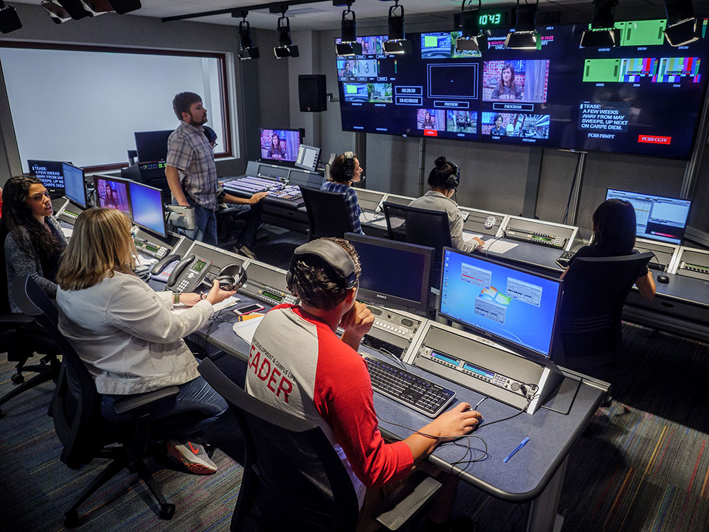 Students work in a broadcast control room to produce Carpe Diem.