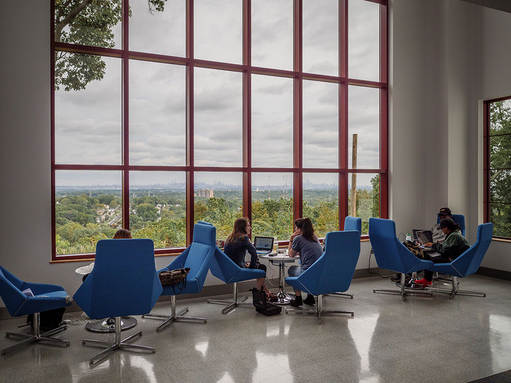 Students enjoying the common space of the new School of Communication and Media building.