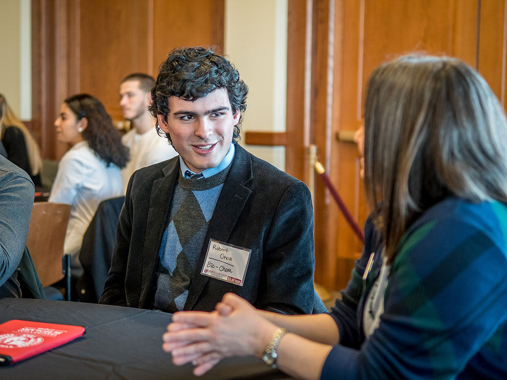 Robert Onoz talking with a female.