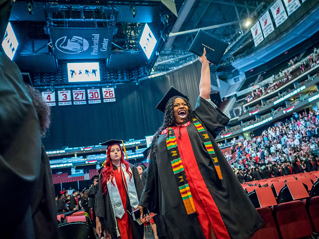 Graduating student celebrating at Commencement
