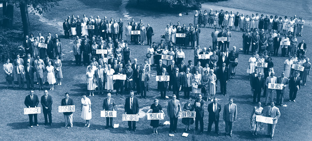 Aerial shot of students/faculty holding up signs of different departments at MSU