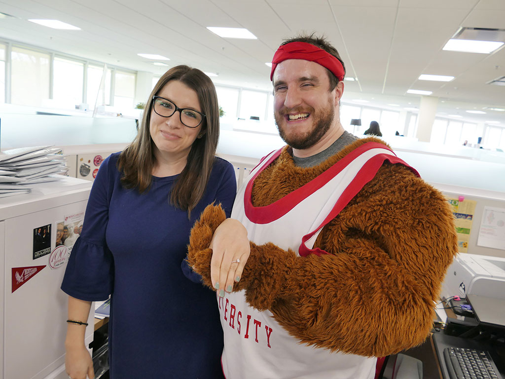 Andrew Fagioli, dressed as Rocky, holding Stacy Albanese's hand with engagement ring.