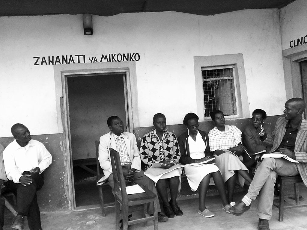 Samwel Marwa meets with colleagues and community leaders on how to improve health services in Tanzania.