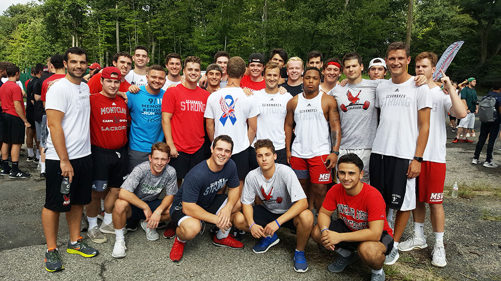 Players wear their Schambach Strong T-shirts.