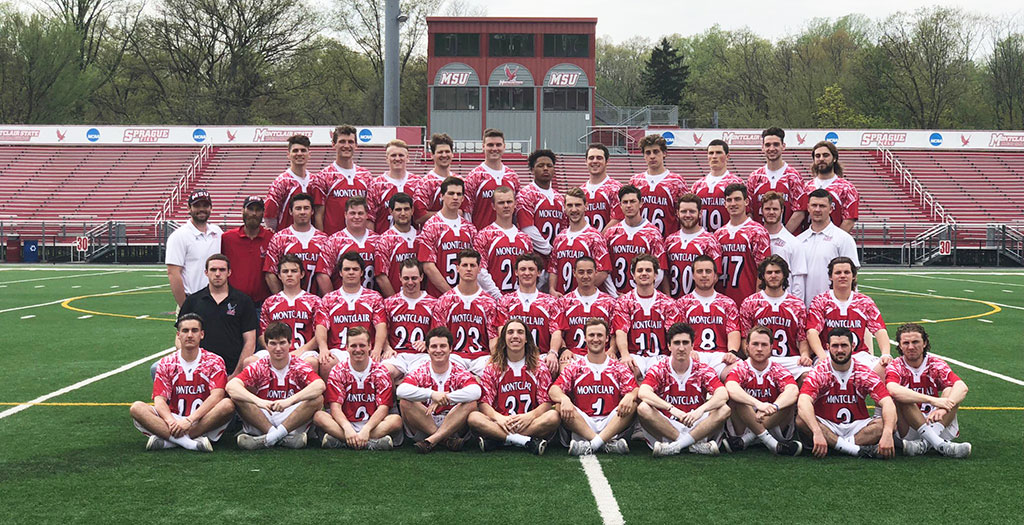 Schambach with the team and coaching staff.