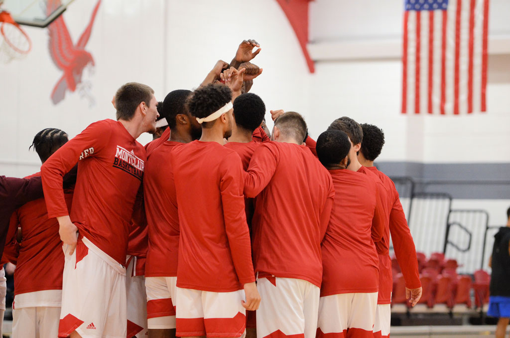 The Red Hawks huddle up before a big win.