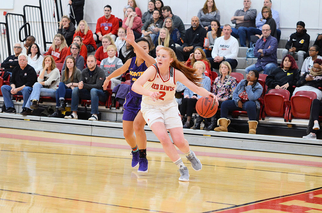 Taylor Brown dribbles past her opponent.