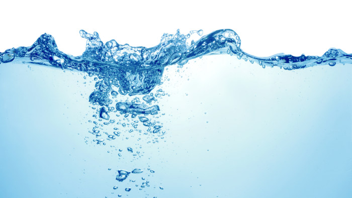 clean blue water with air bubbles and splashes on white background