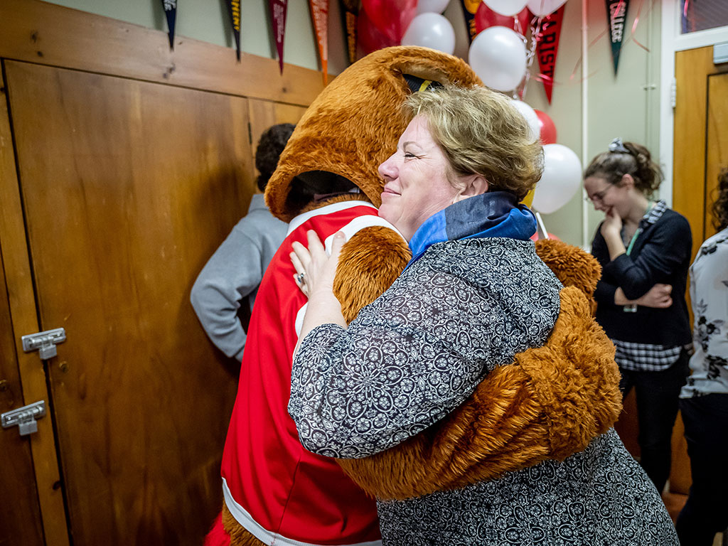 Silvia Povolo hugs Rocky at Montclair State’s surprise reveal of the admissions offer for her quintuplets.