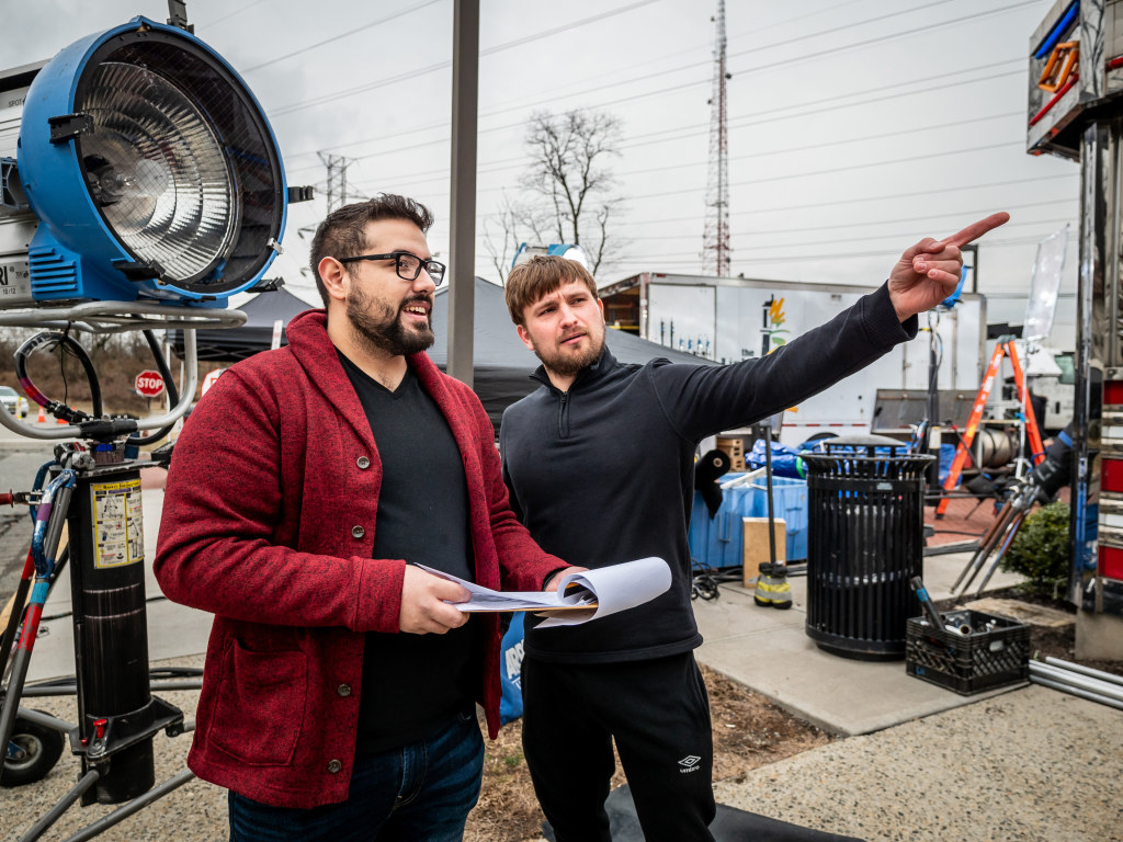 Jonathan Padilla ’19 (left) and Jakub Deptula ’20 film an advertisement for a leading clothing company at the Red Hawk Diner on March 3, 2020.