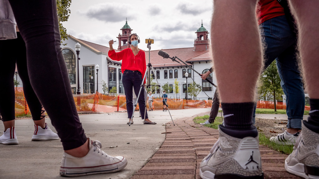 Associate Professor Tara George teaches her journalism class outside.