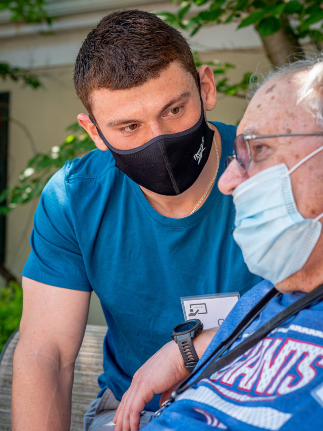 “It was as if we were lifelong friends,” says junior Gregory Carmona of meeting, finally in person, his “video pal,” John Zbozen Jr., a retired U.S. Army mapmaker, with whom he spent Friday mornings throughout the spring on Zoom to talk about food and life.