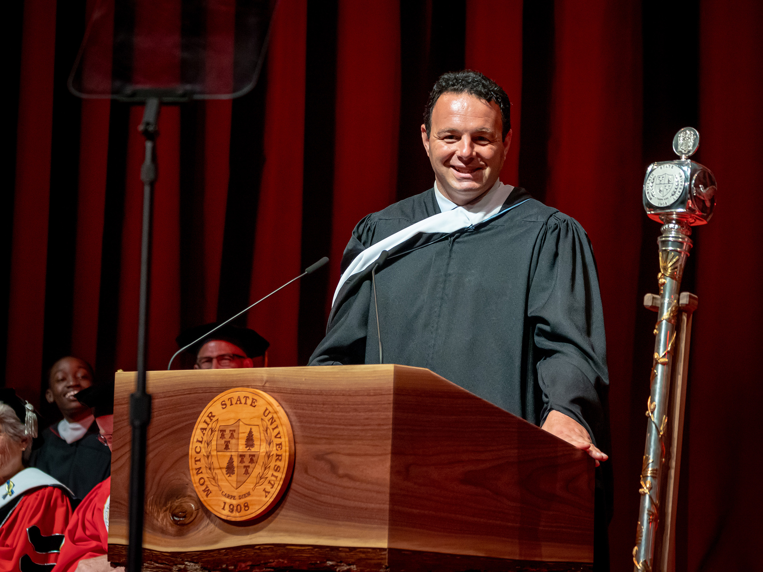 Paterson Mayor Andre Sayegh speaking at podium