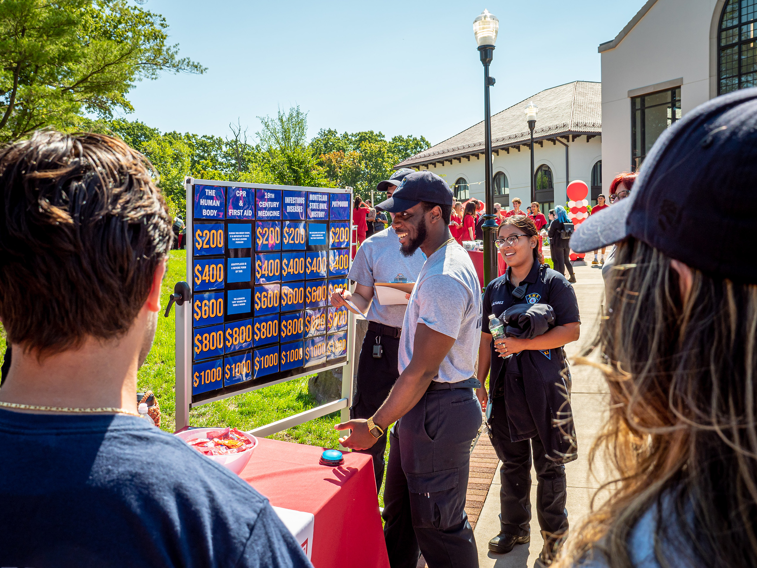 students in front of a jeopardy grid