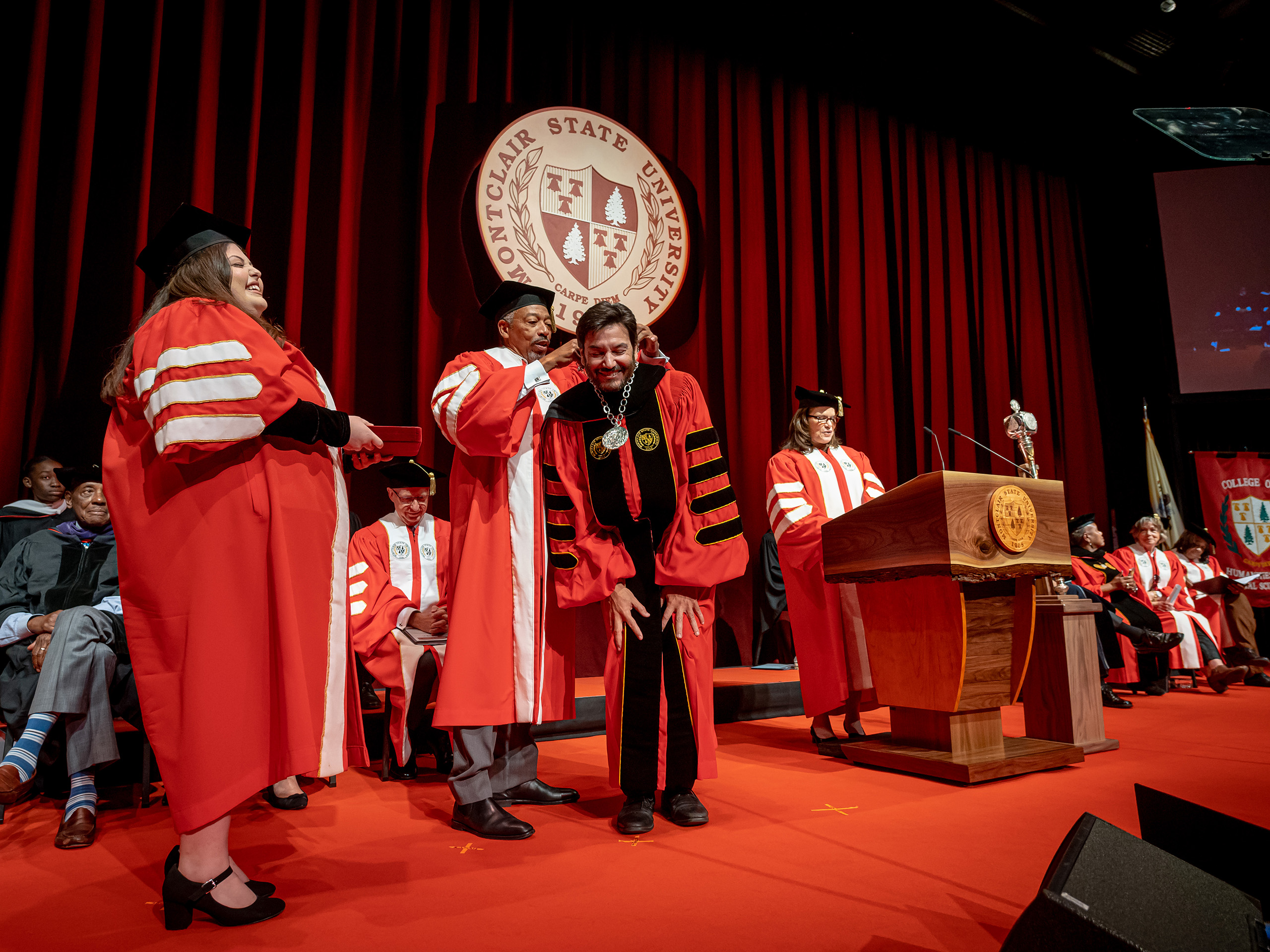 Trustee Preston Pinkett placing the medallion on President Koppell