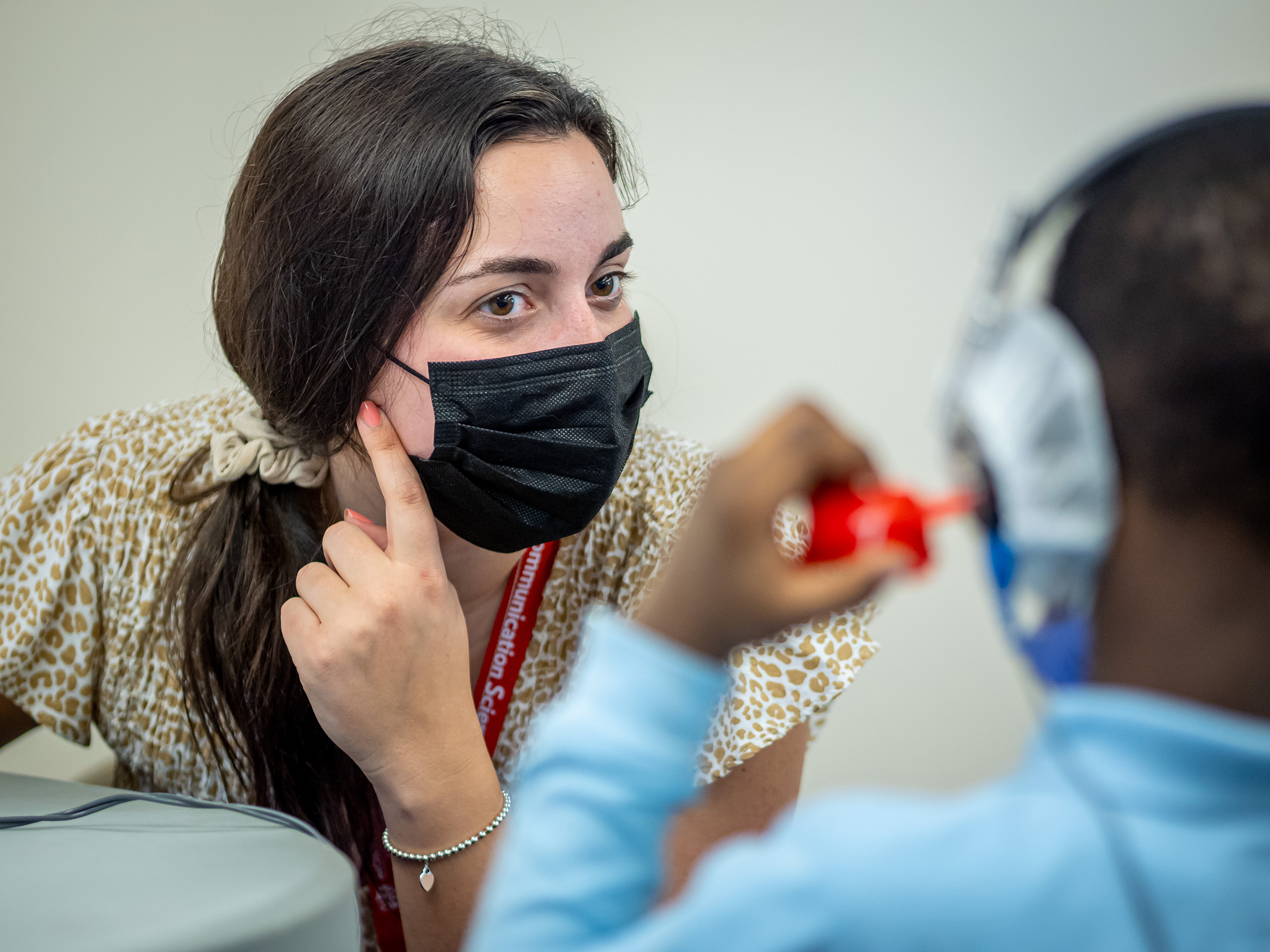 Montclair audiology student Nicole Genser administering a hearing test