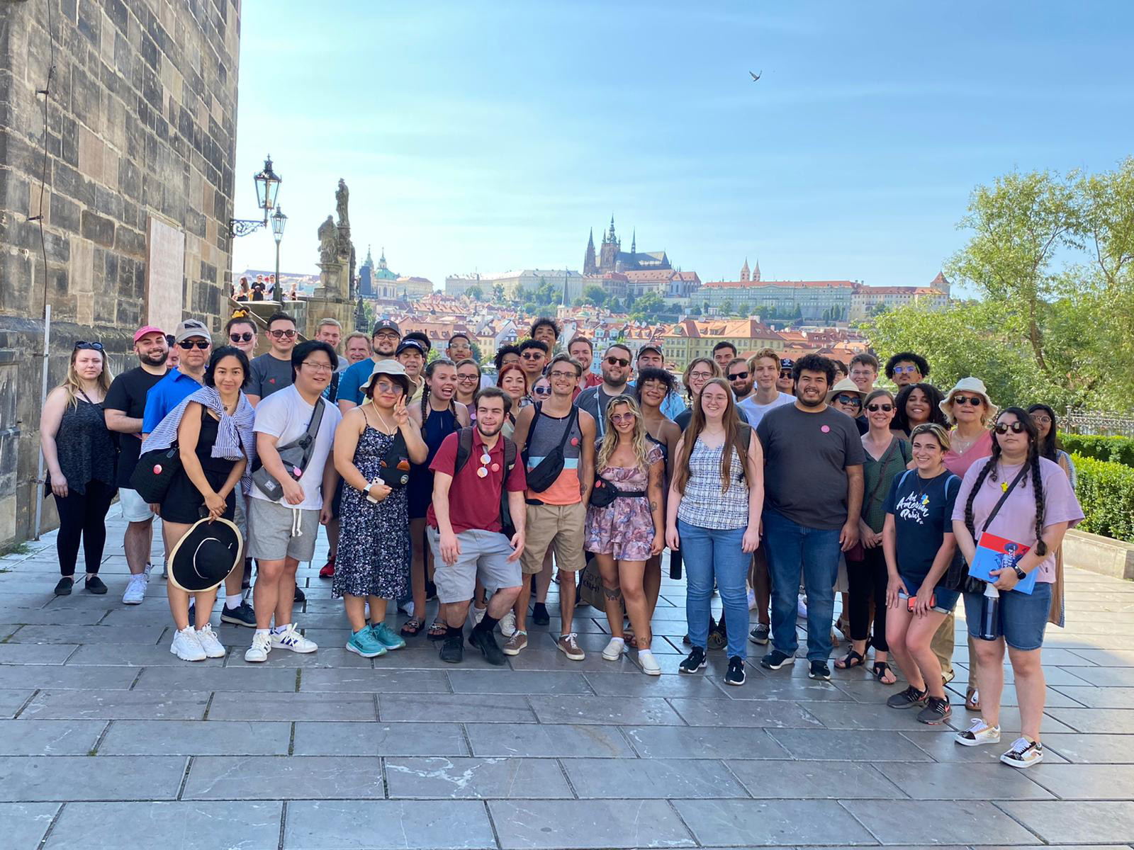 Group of musicians pose in the city of Prague