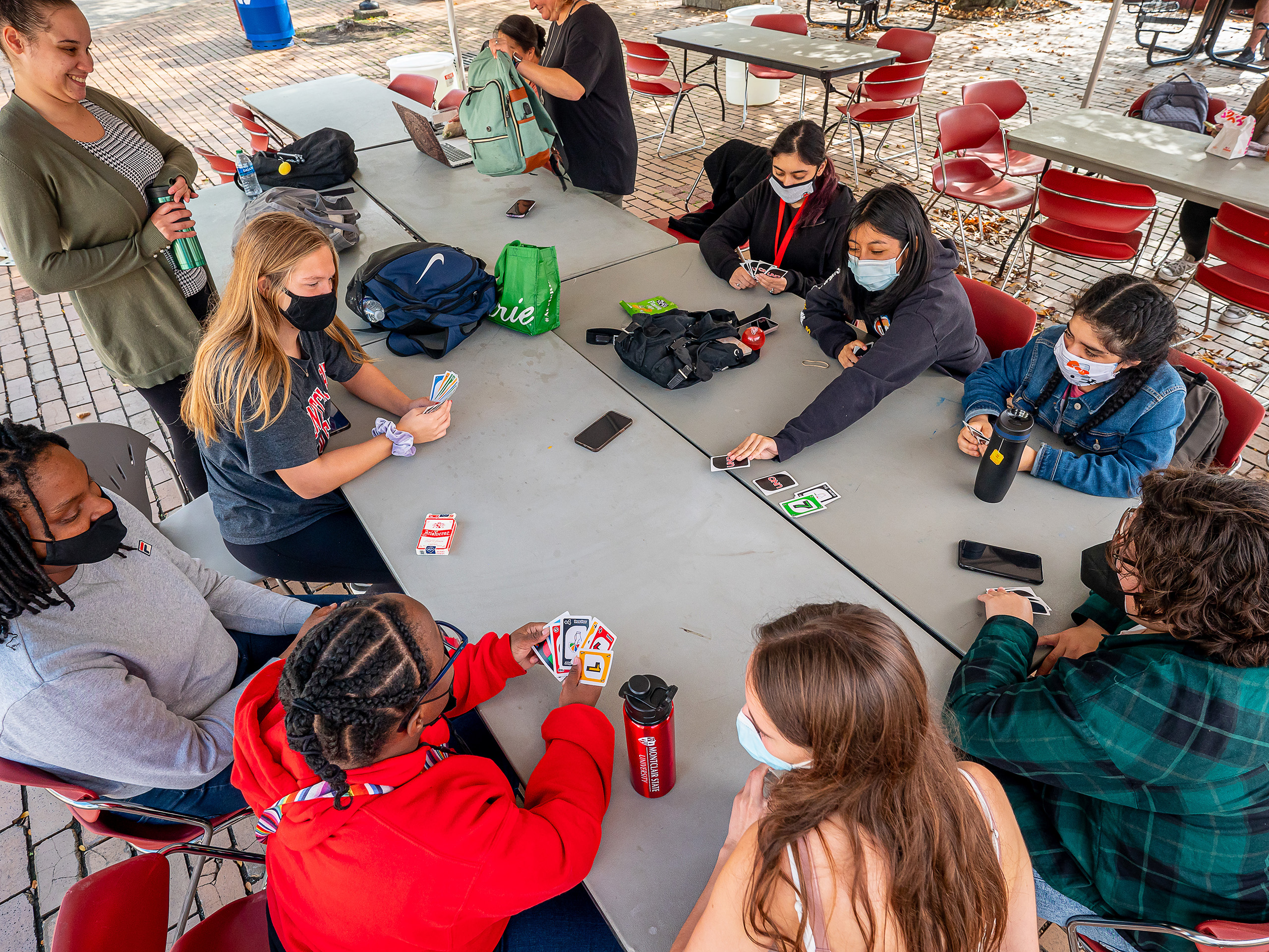 Volunteers and students in the Increasing Access to College project playing Uno.