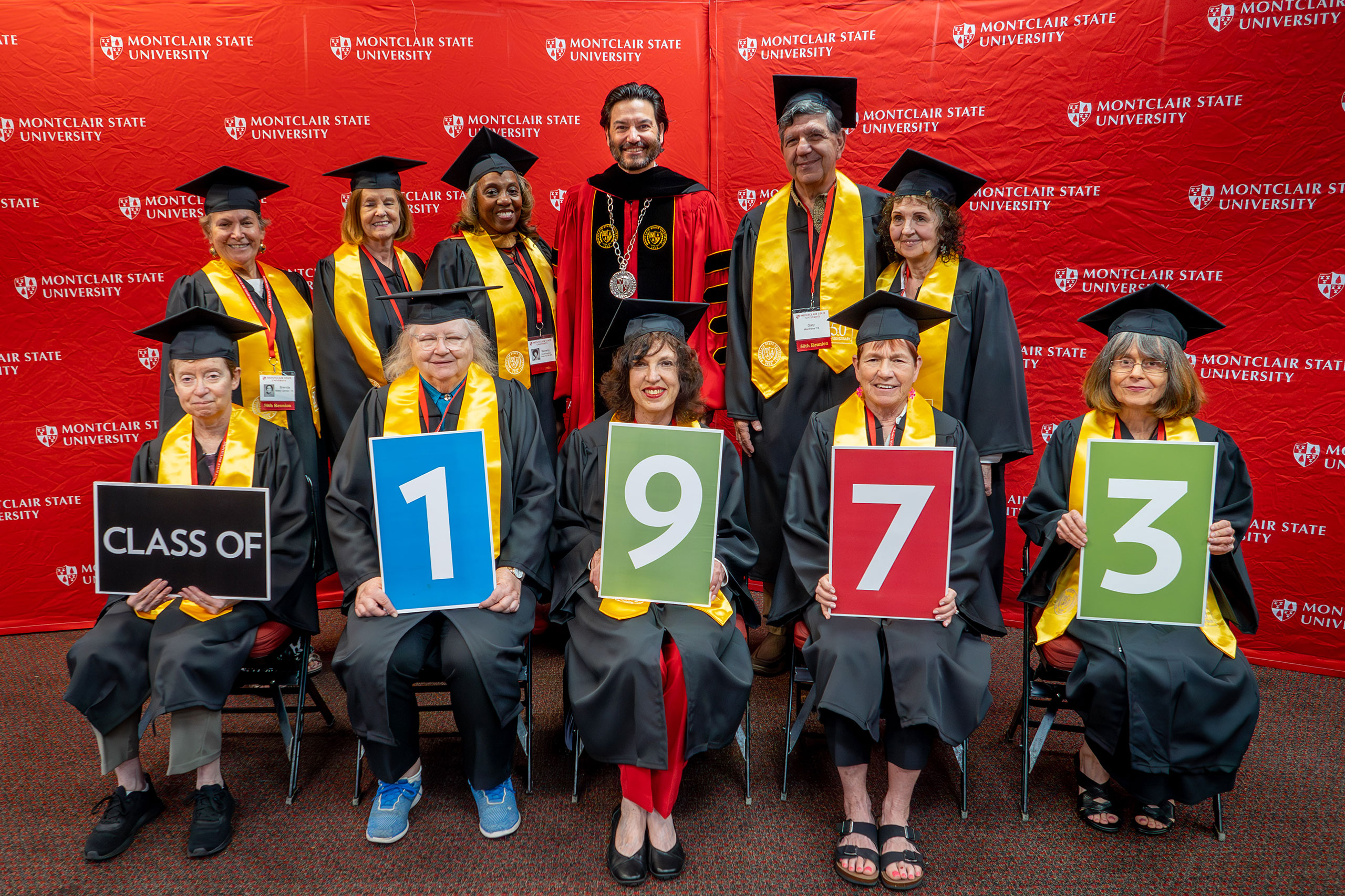 members of the class of 1973 wearing caps and gowns