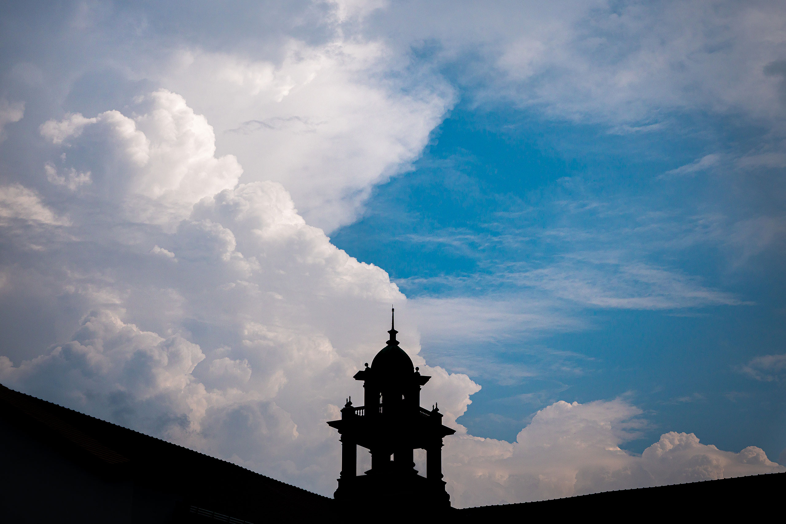 clouds in sky over Cole Hall bell tower