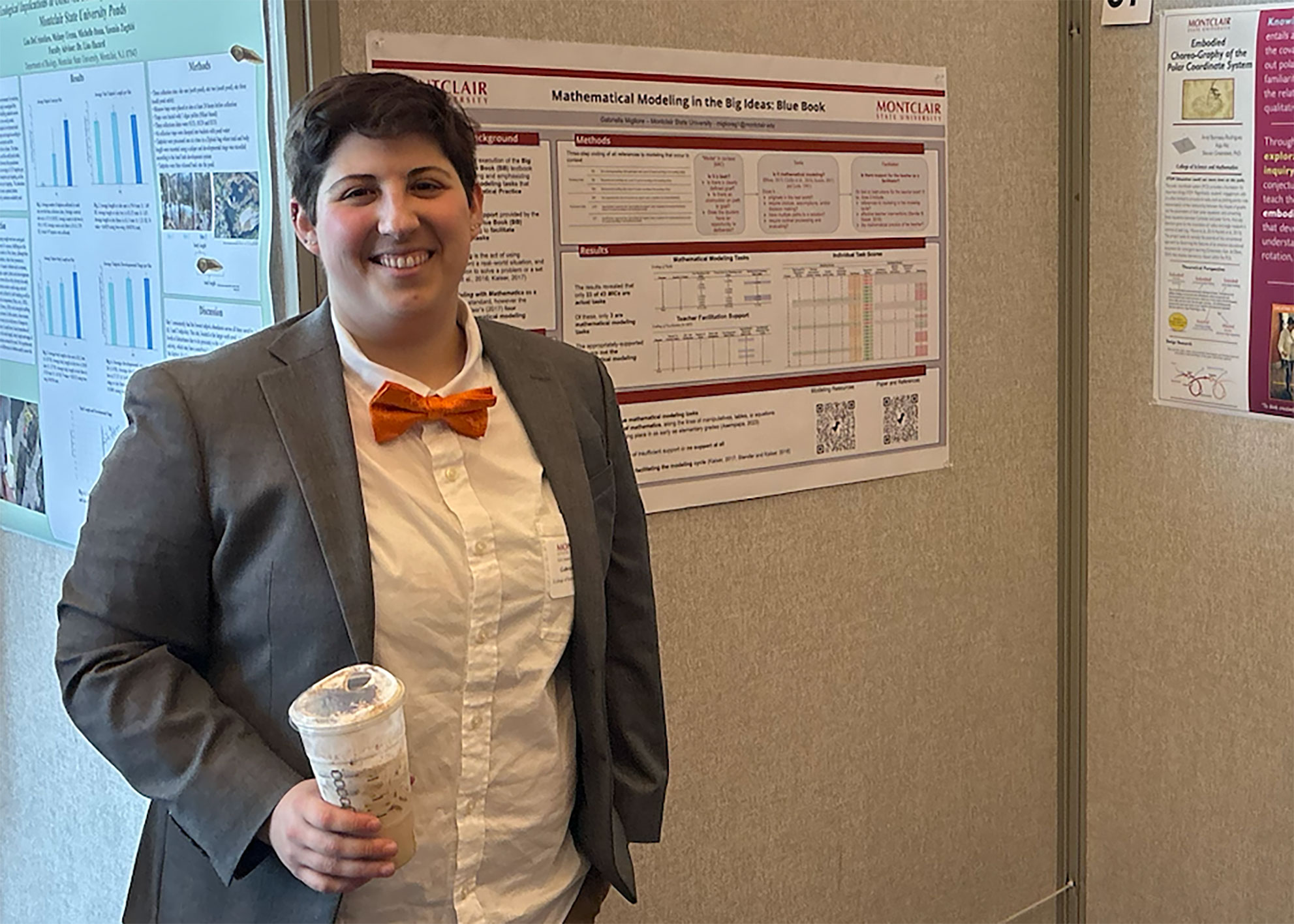 Gabriella Migliore with her poster at the Student Research Symposium