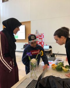 Ayah and Megan help a student with Fibonacci’s sequence Hershey kisses