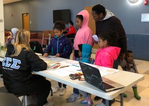 Tara helps students with Bhaskara’s proof of the Pythagorean Theorem at our Welcome Station