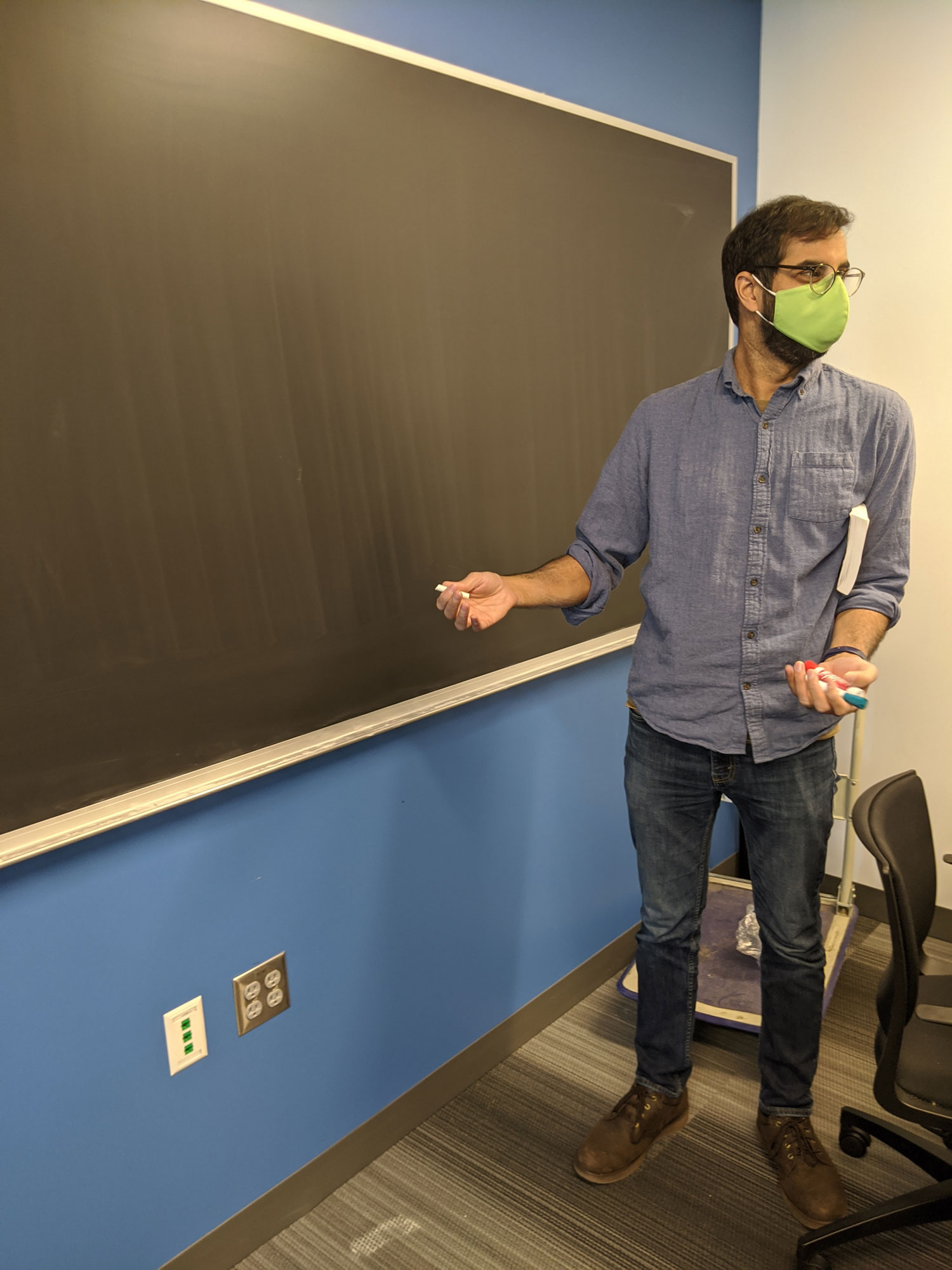 Dr. Bal preparing to write on the new blackboard