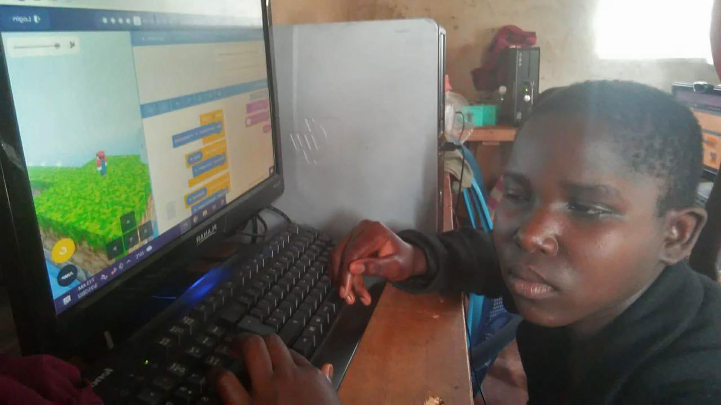STEM Center Africa playing computer game