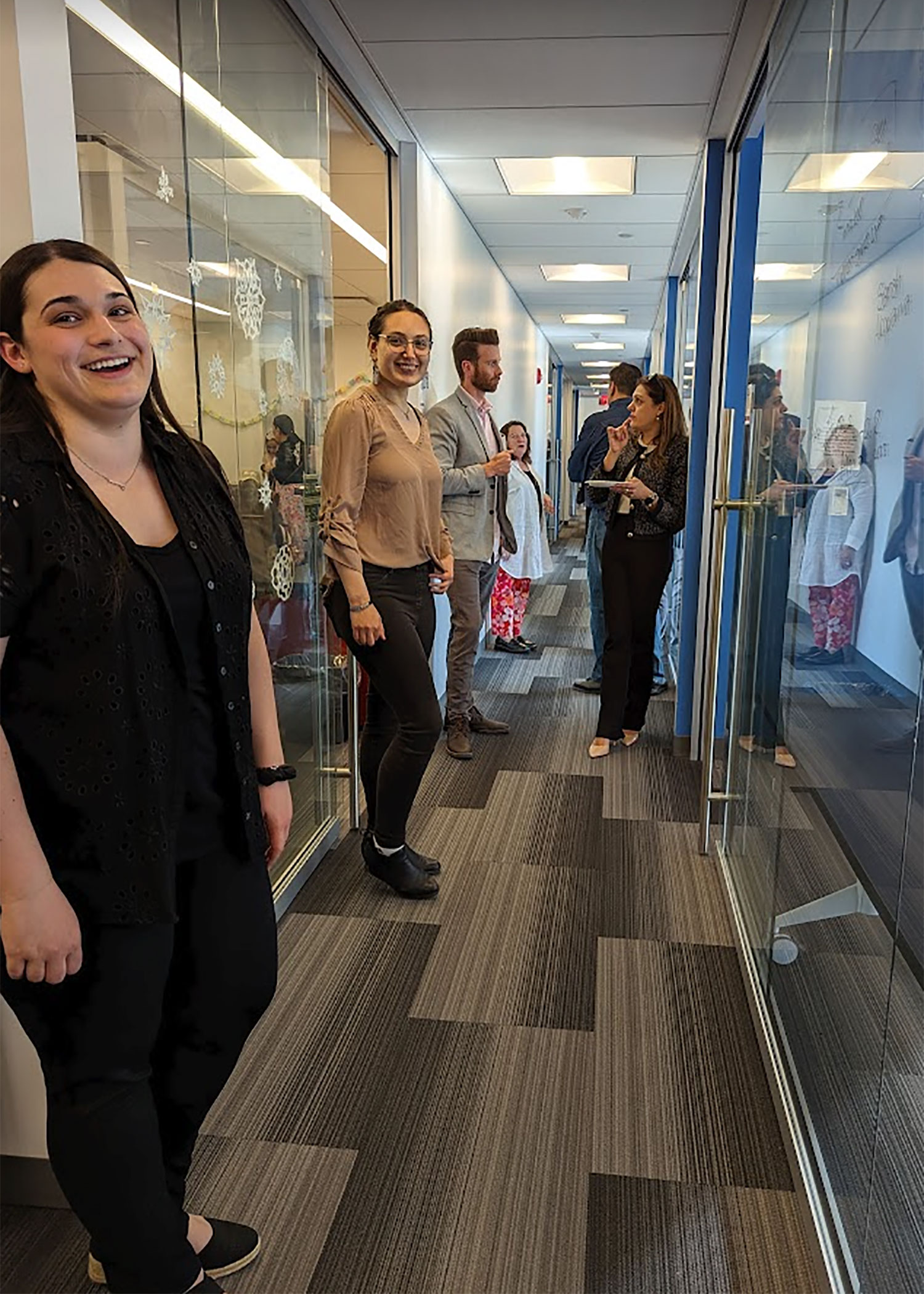 graduating students signing wall of memories in Math Department