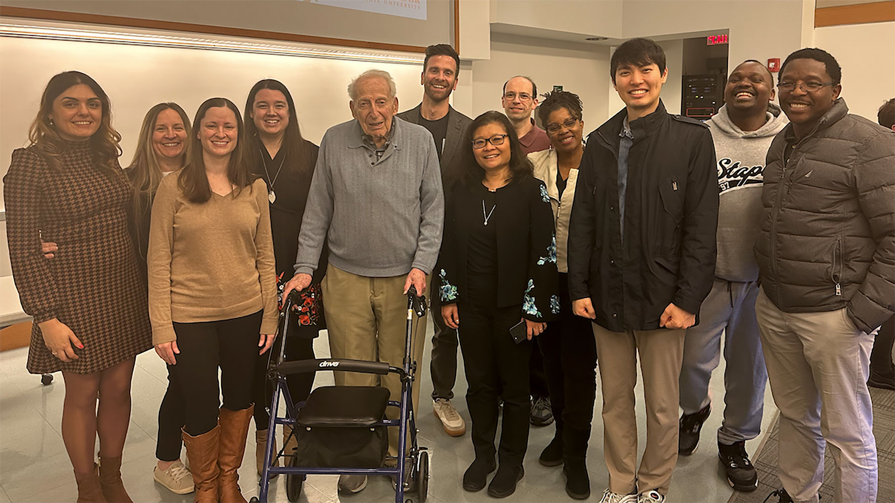 Faculty and doctoral students with Dr. Pollak
