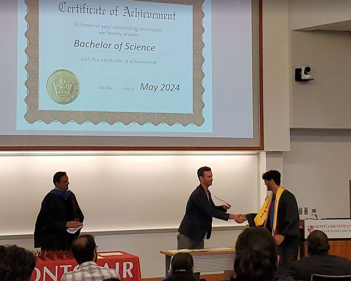 DiNapoli congratulating student