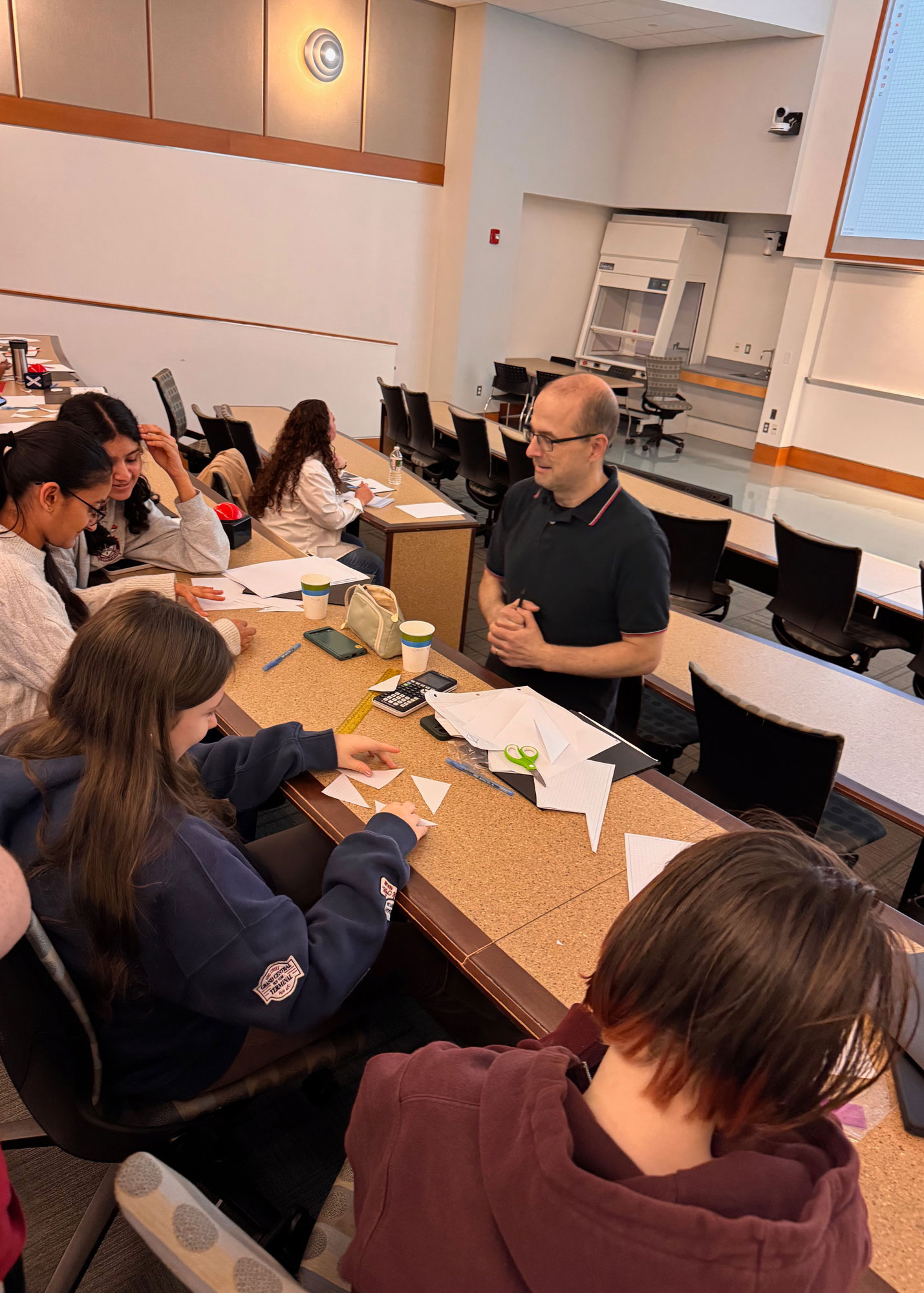 Dr. Bogdan Nita working with students at Math and Art Day 2025