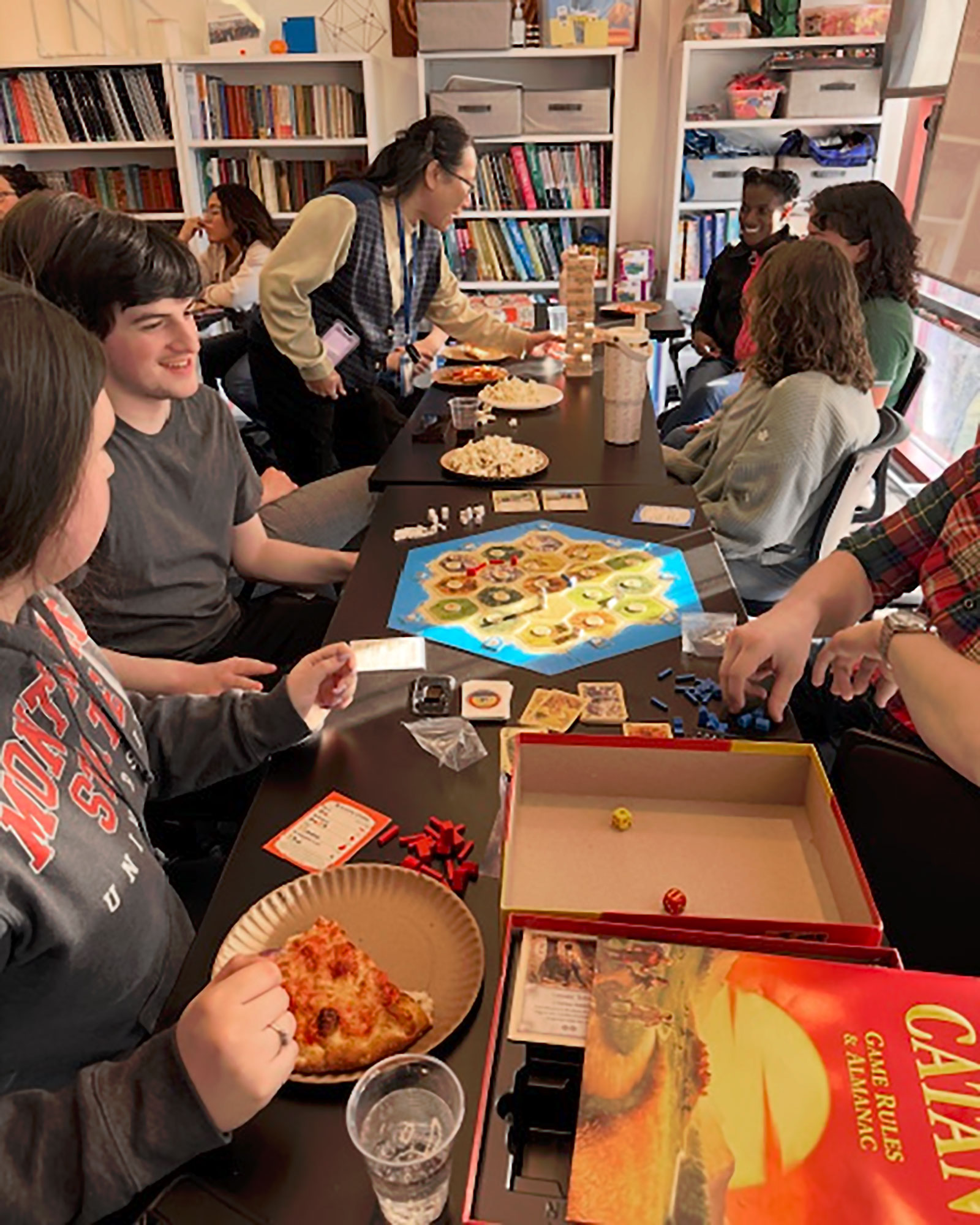 students playing Catan and Jenga