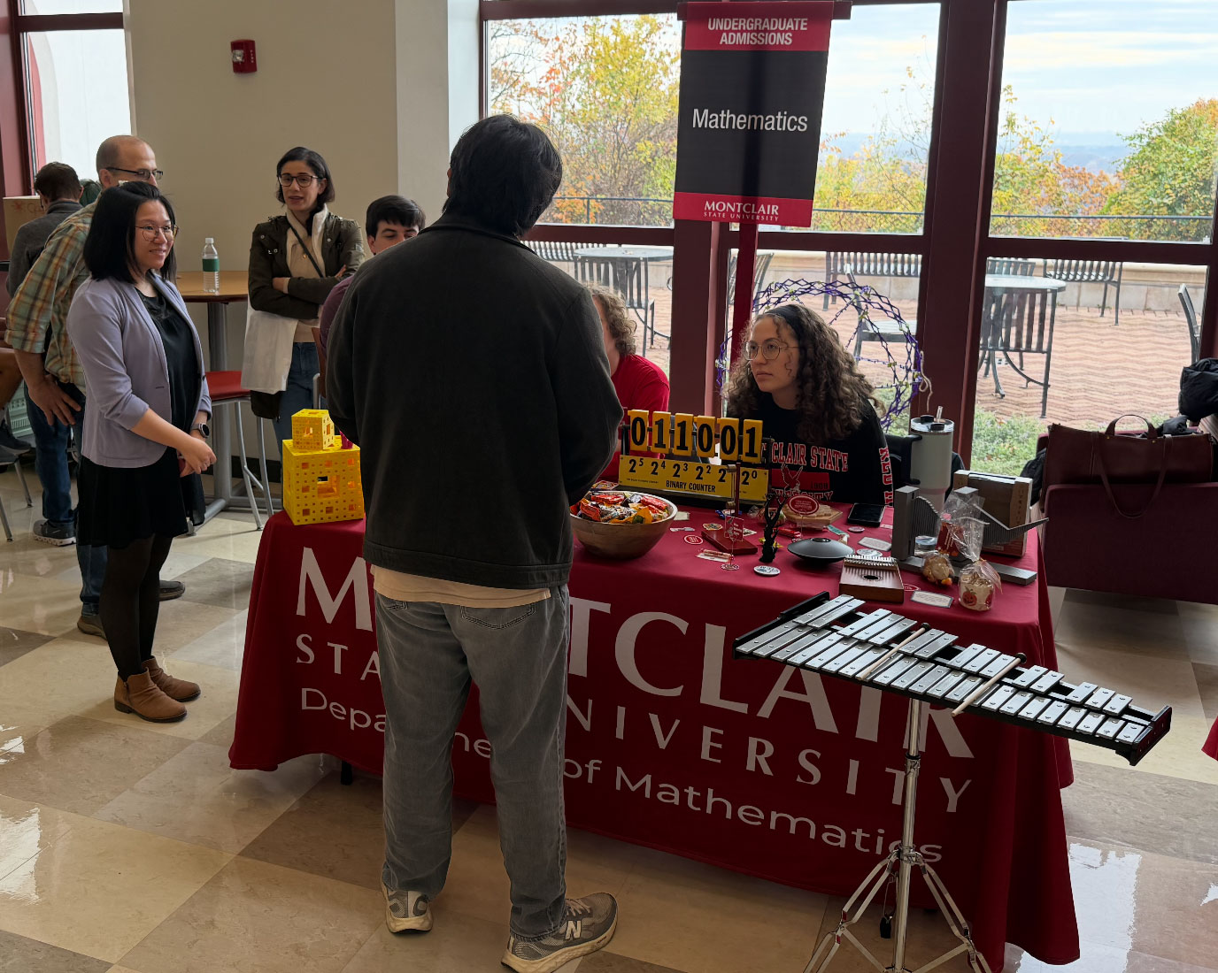 Math department table at fall 2025 open house helping prospective student