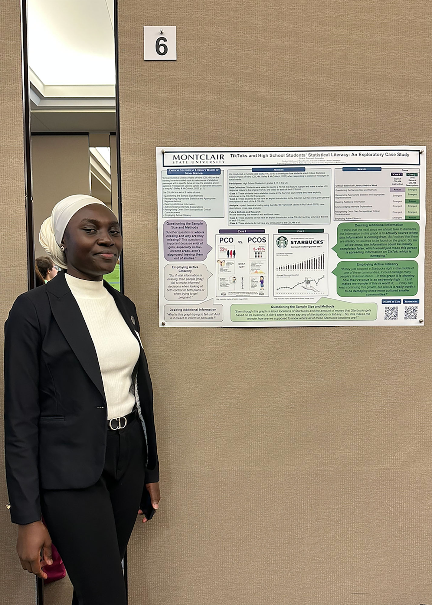 Grace Pomaah Amoako with her poster at the Student Research Symposium