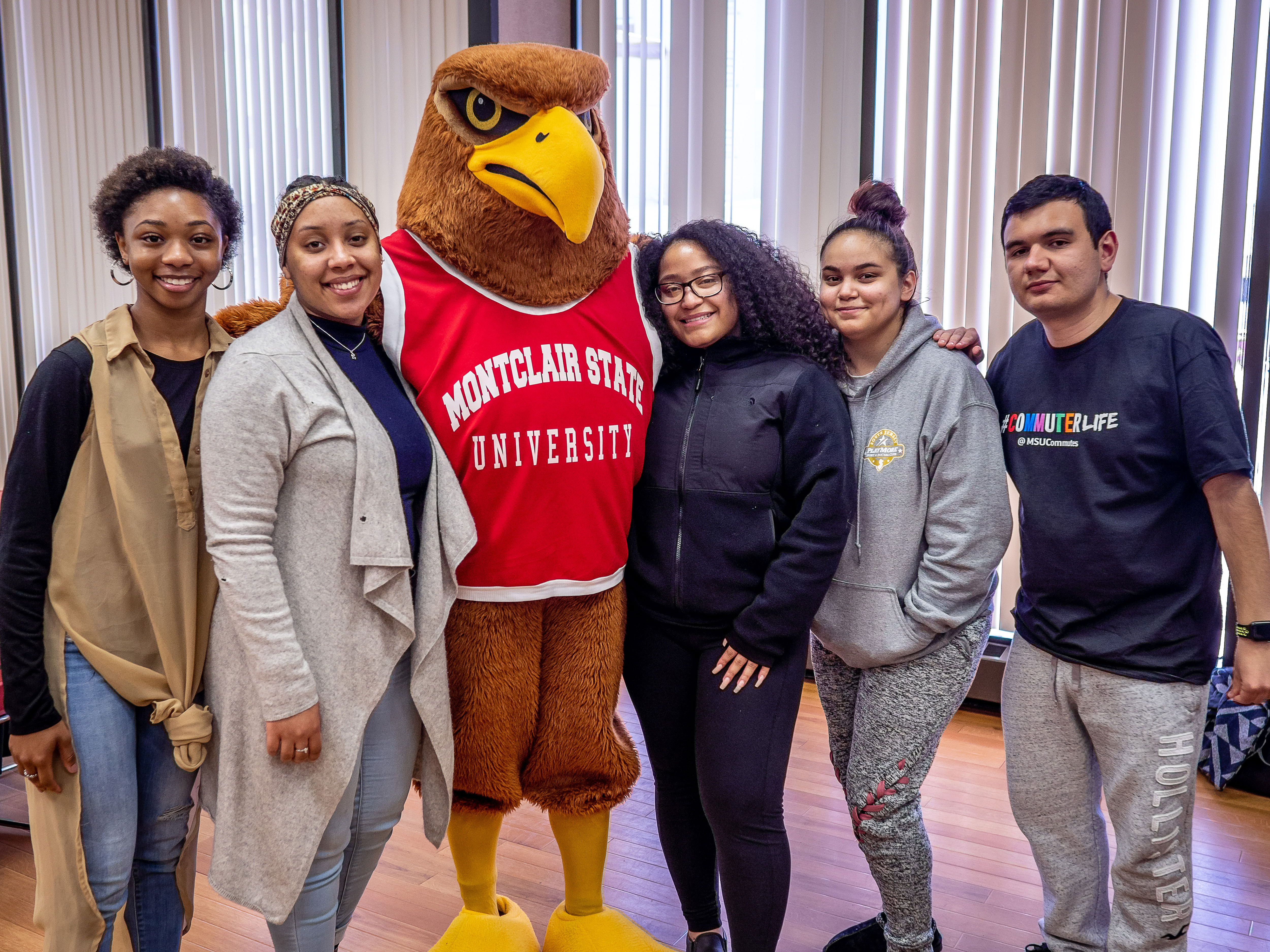 Students with Rocky the Red Hawk